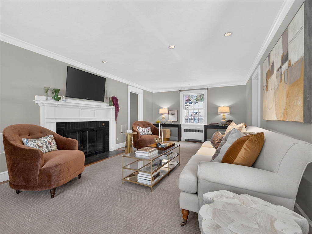 5 Tennyson Road Wellesley, MA 02481 - Photo 4 of 28 a living room with furniture a fireplace and a flat screen tv