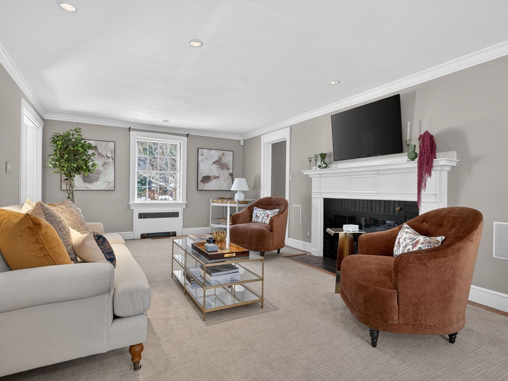 5 Tennyson Road Wellesley, MA 02481 - Photo 5 of 28 a living room with furniture a flat screen tv and a fireplace