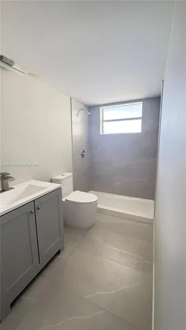 a view of bathroom with a bathtub a sink and mirror