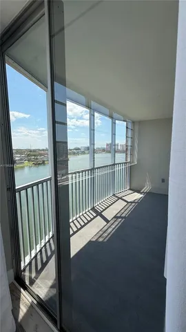 a view of balcony with a floor to ceiling window