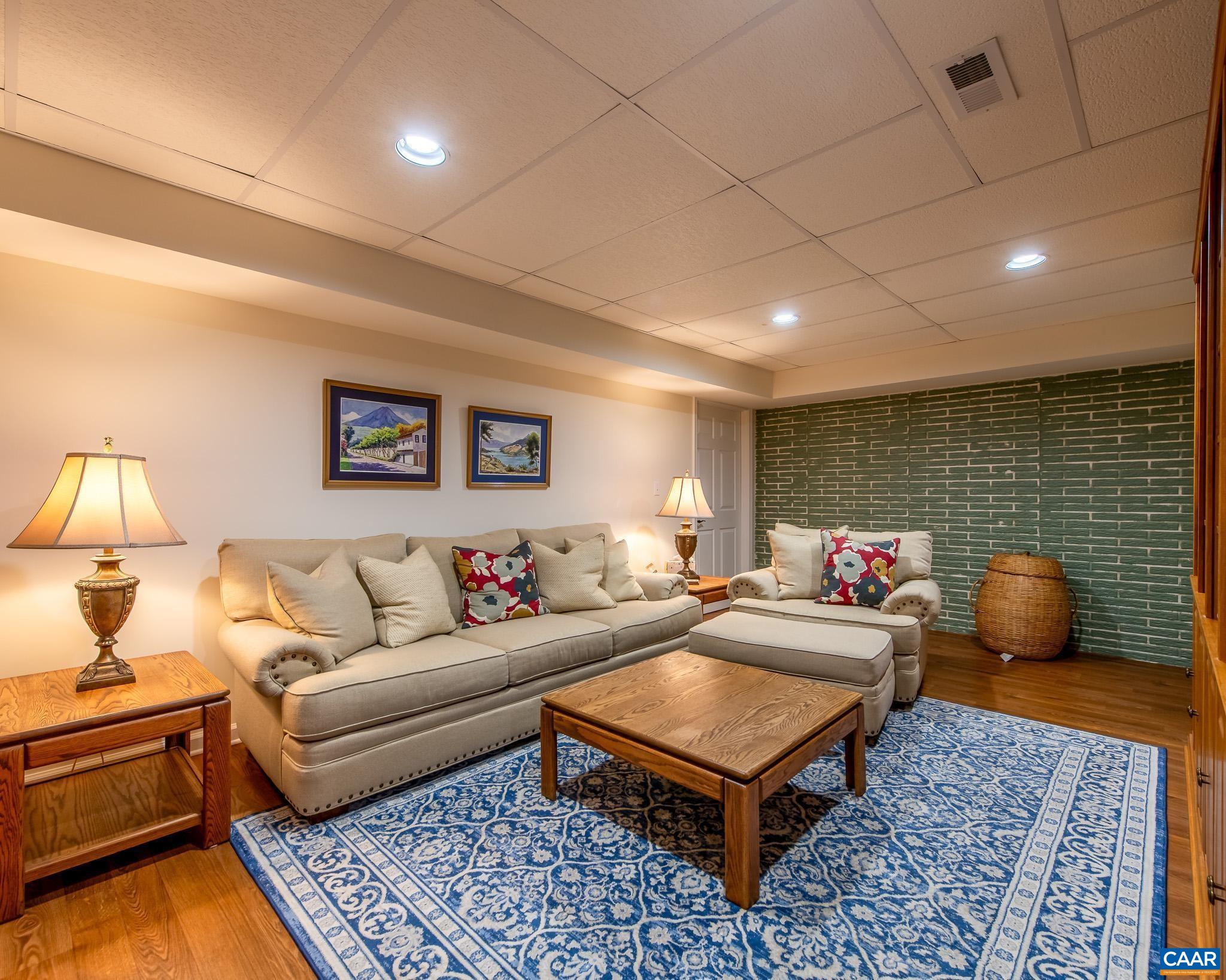 1089 Broken Island Road Palmyra, VA 22963 - Photo 50 of 74 a living room with furniture rug and lamp