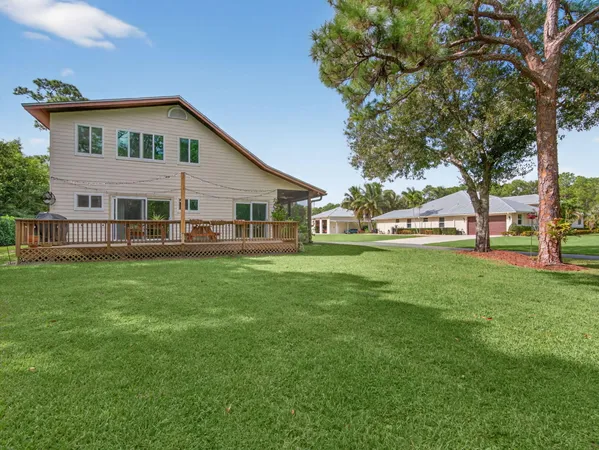 a front view of house with yard and outdoor seating