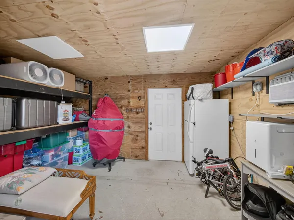 a room with lots of furniture and air hockey table