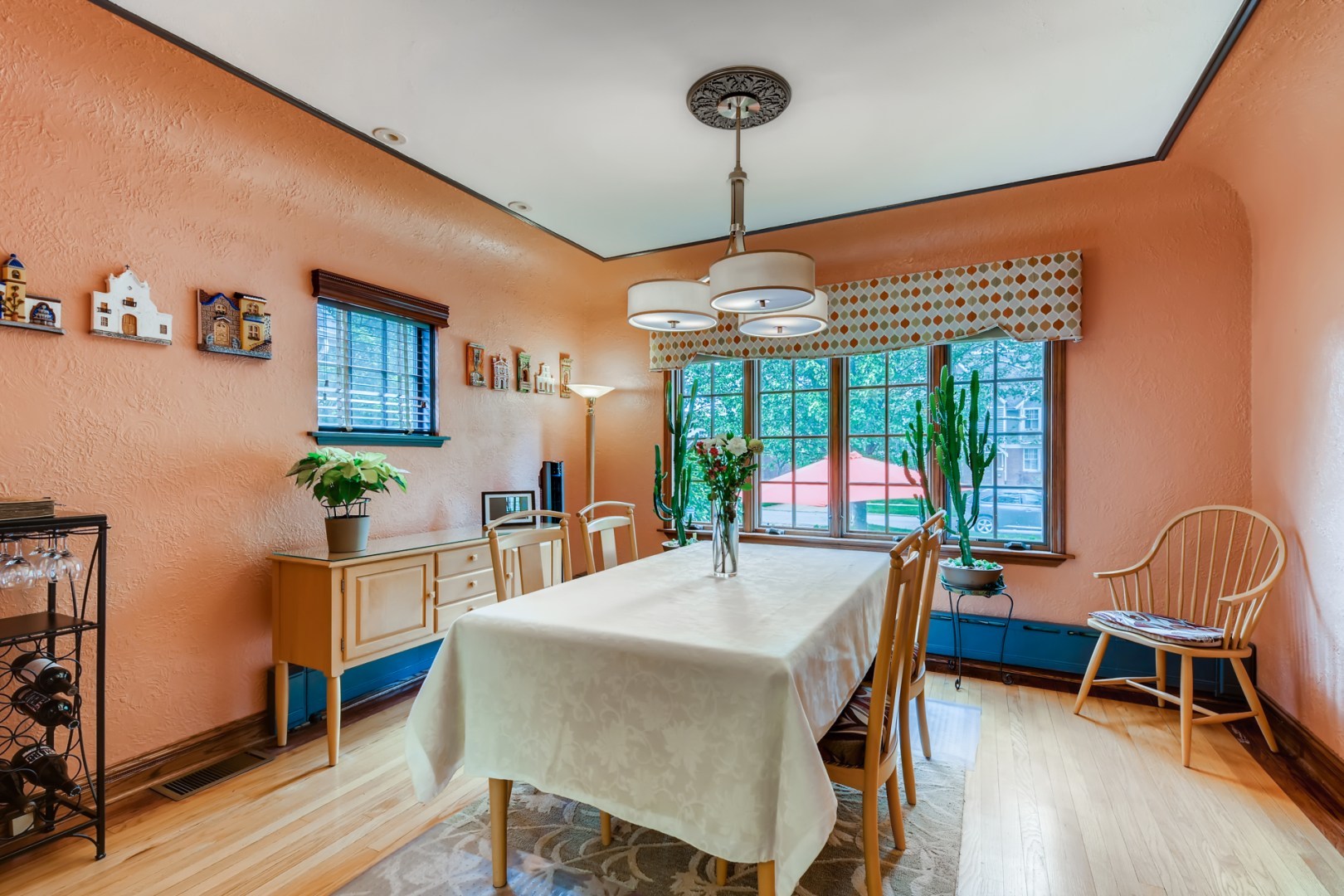 300 Blythe Road Riverside, IL 60546 - Photo 7 of 31 a dining room with furniture a chandelier and wooden floor