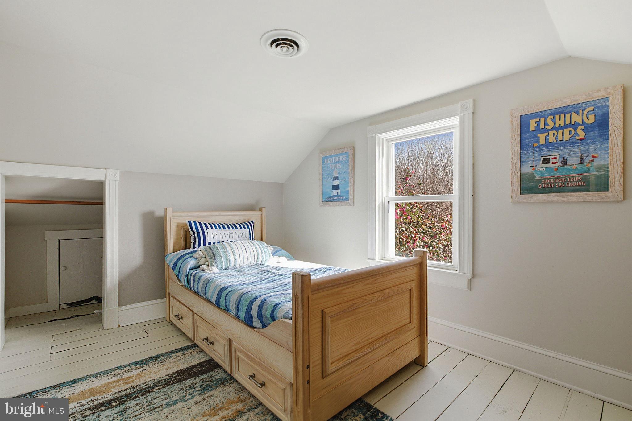 519 Whitehall Road Lancaster, VA 22503 - Photo 29 of 46 a room with a bed and a window