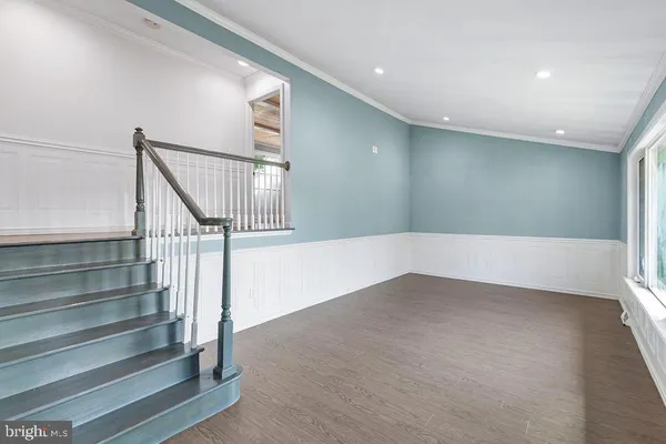 a view of an empty room with stairs