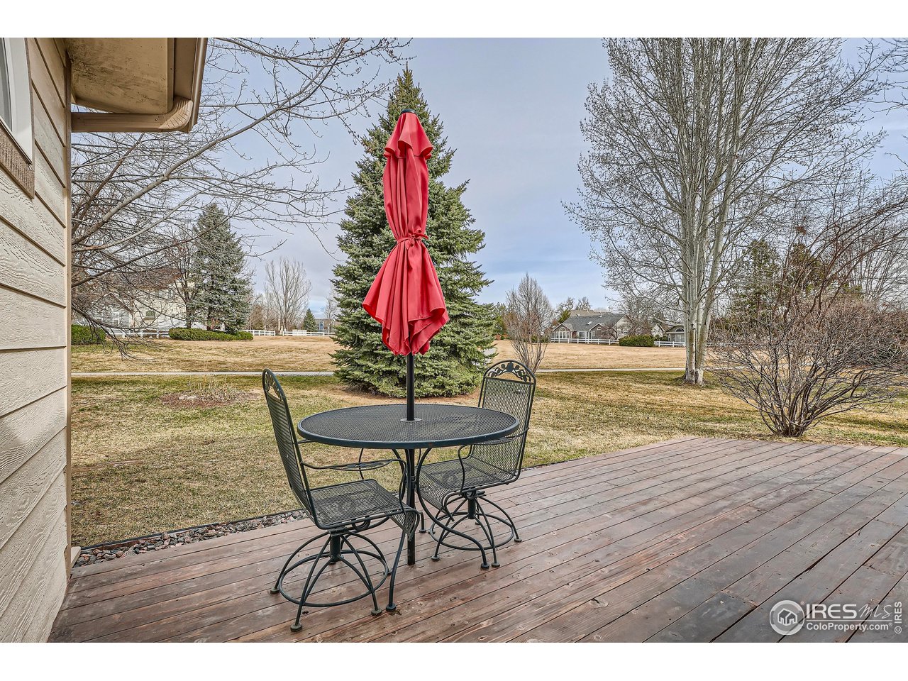 7051 Johnson Circle Niwot, CO 80503 - Photo 11 of 34 a view of a dining room with furniture and wooden floor