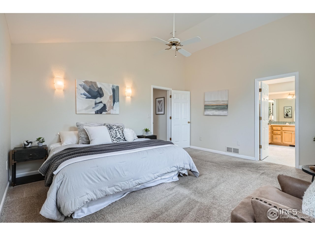 7051 Johnson Circle Niwot, CO 80503 - Photo 13 of 34 a bedroom with a bed and painting on the wall