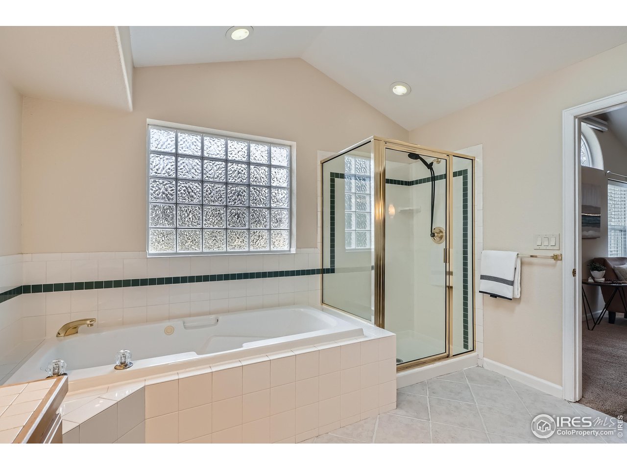 7051 Johnson Circle Niwot, CO 80503 - Photo 16 of 34 a bathroom with a bathtub and a shower
