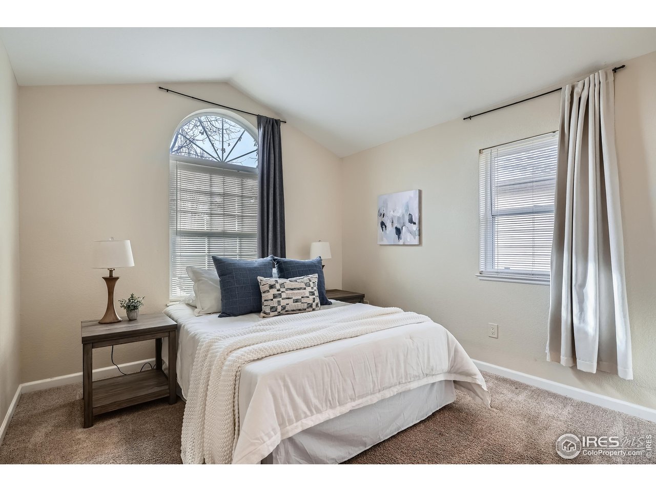 7051 Johnson Circle Niwot, CO 80503 - Photo 18 of 34 a bedroom with a bed and a window