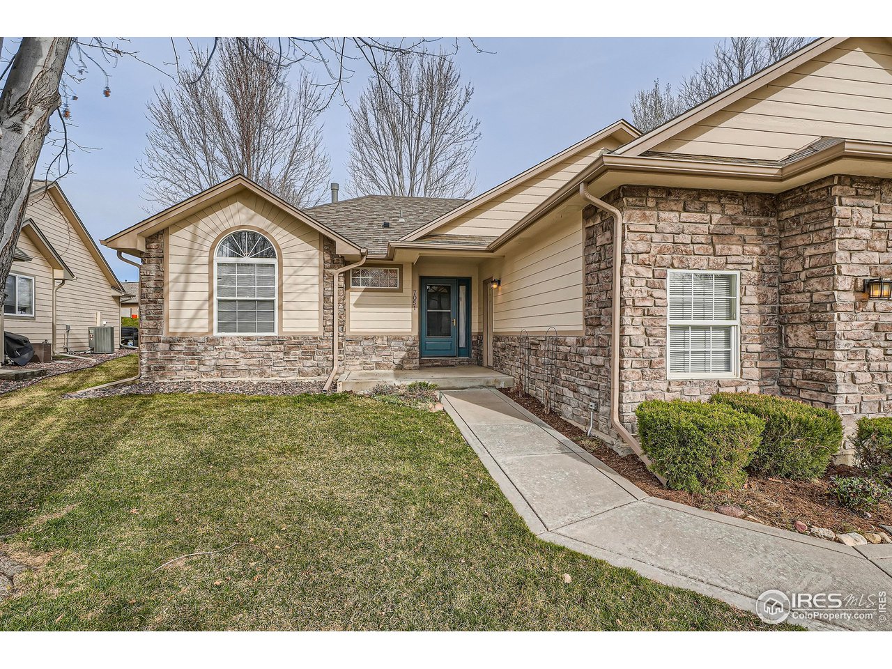 7051 Johnson Circle Niwot, CO 80503 - Photo 2 of 34 a front view of a house with garden