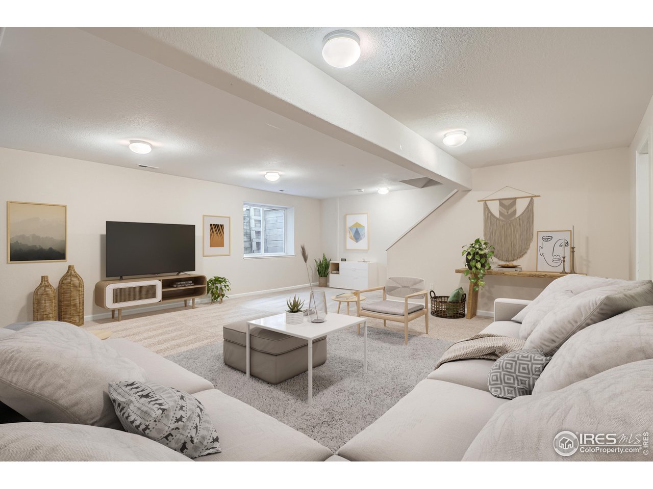 7051 Johnson Circle Niwot, CO 80503 - Photo 22 of 34 a living room with furniture and a flat screen tv