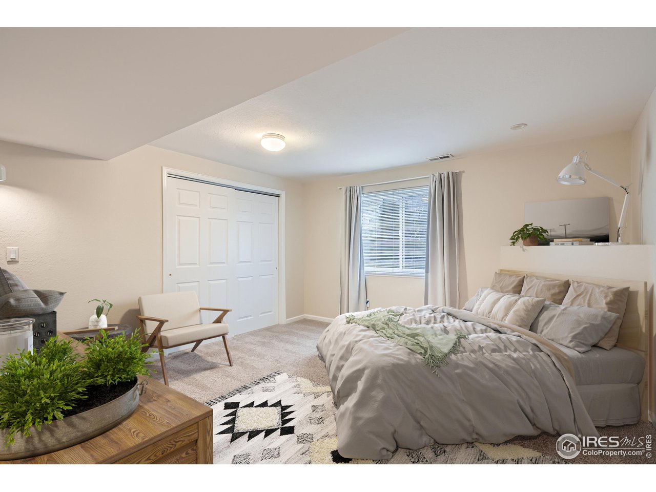 7051 Johnson Circle Niwot, CO 80503 - Photo 23 of 34 a bedroom with a bed windows and a potted plant