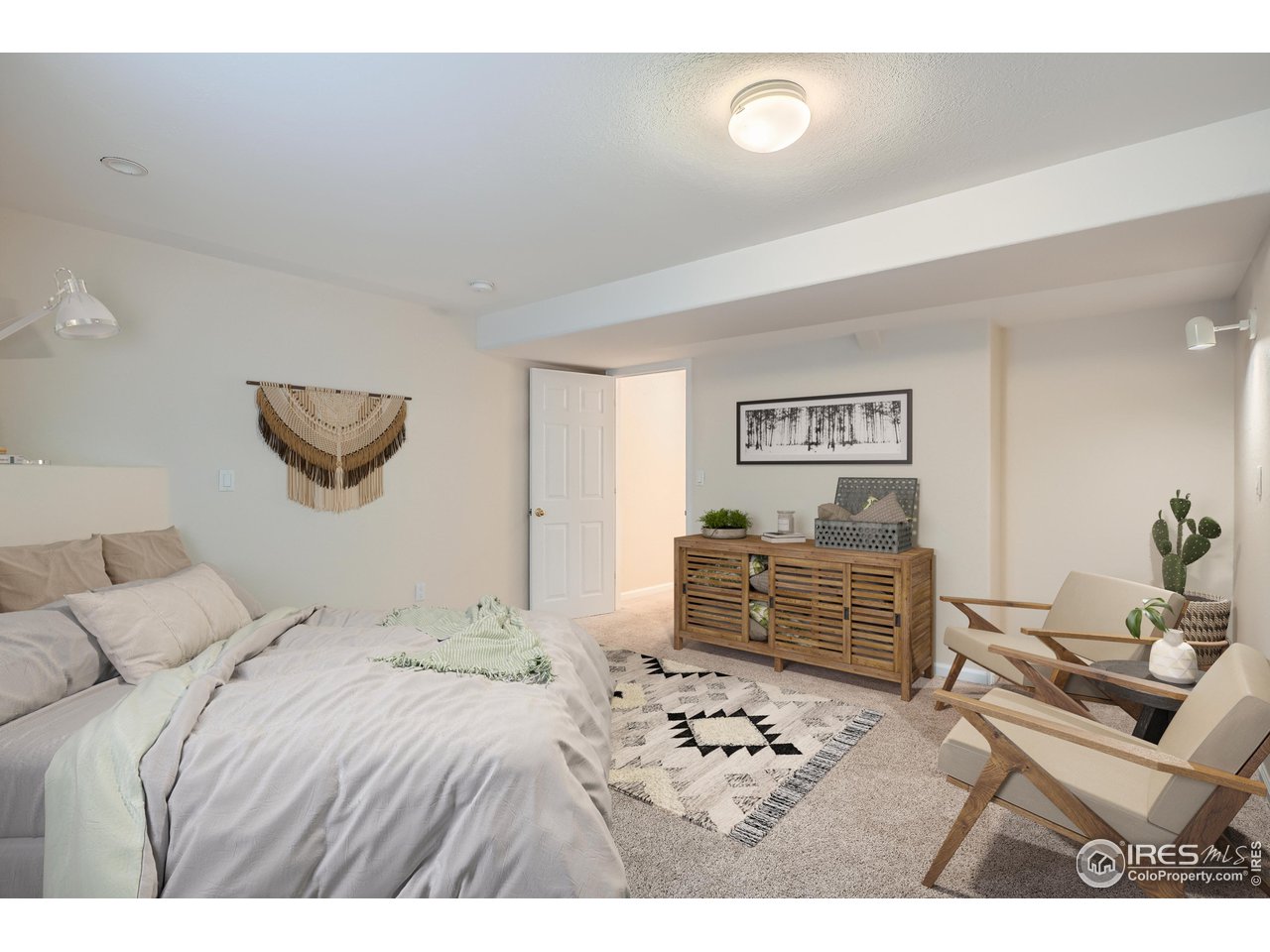 7051 Johnson Circle Niwot, CO 80503 - Photo 24 of 34 a bedroom with a bed and a dresser
