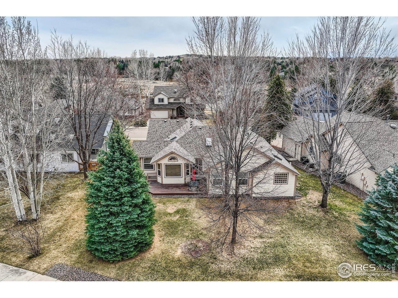 7051 Johnson Circle Niwot, CO 80503 - Photo 28 of 34 a view of a house with a yard and sitting area