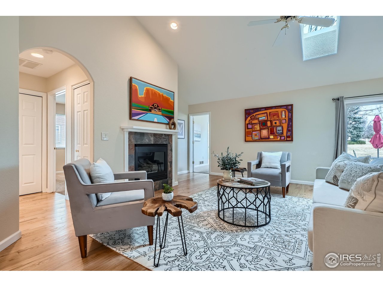 7051 Johnson Circle Niwot, CO 80503 - Photo 3 of 34 a living room with furniture a flat screen tv and a fireplace