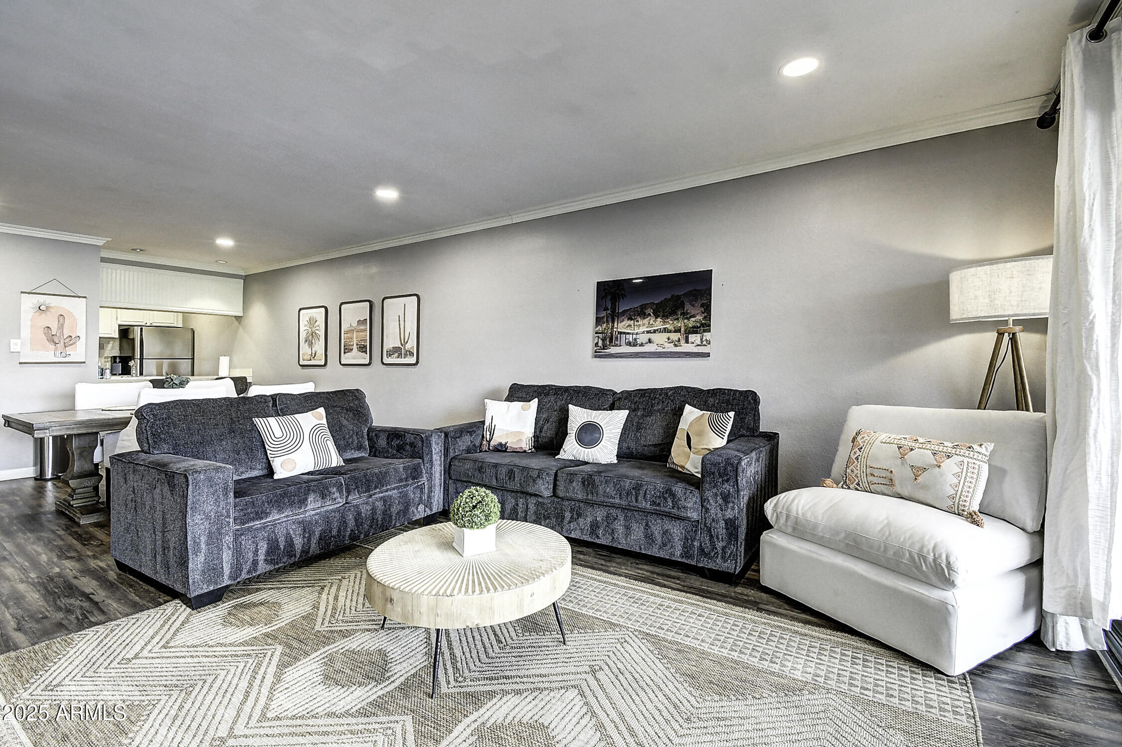 7625 East Camelback Road, Unit B203 Scottsdale, AZ 85251 - Photo 1 of 29 a living room with furniture and a wooden floor