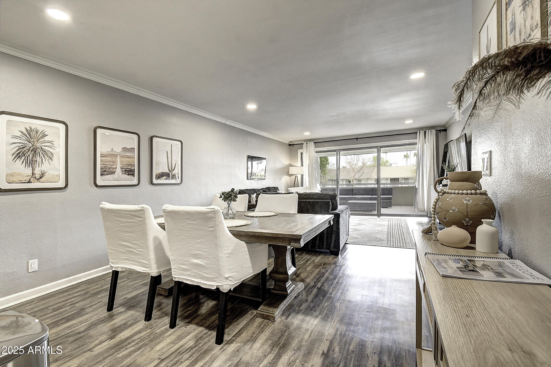 7625 East Camelback Road, Unit B203 Scottsdale, AZ 85251 - Photo 11 of 29 a view of a dining room with furniture and wooden floor