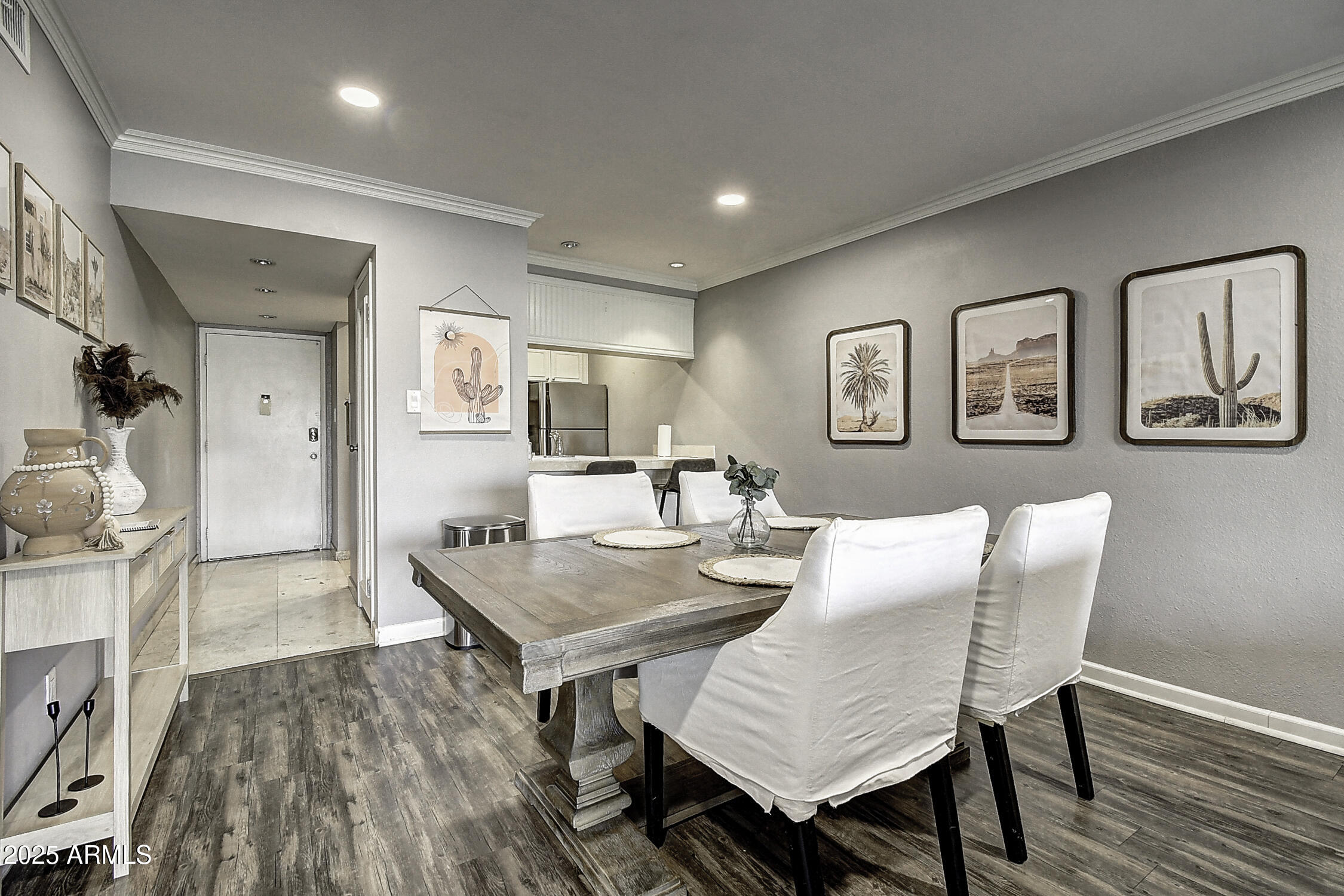 7625 East Camelback Road, Unit B203 Scottsdale, AZ 85251 - Photo 12 of 29 a view of a dining room with furniture and wooden floor