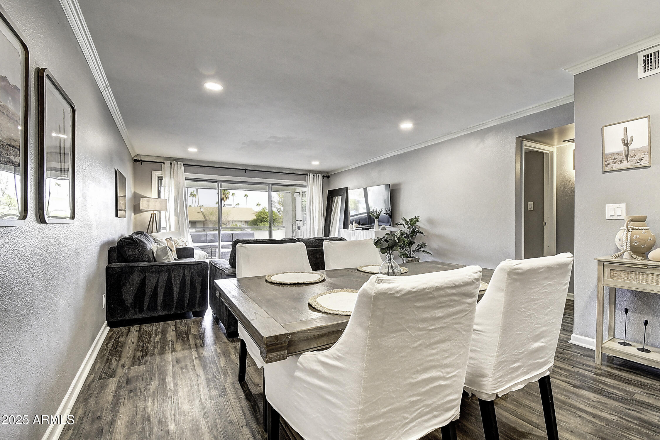 7625 East Camelback Road, Unit B203 Scottsdale, AZ 85251 - Photo 14 of 29 a dining room with furniture and wooden floor