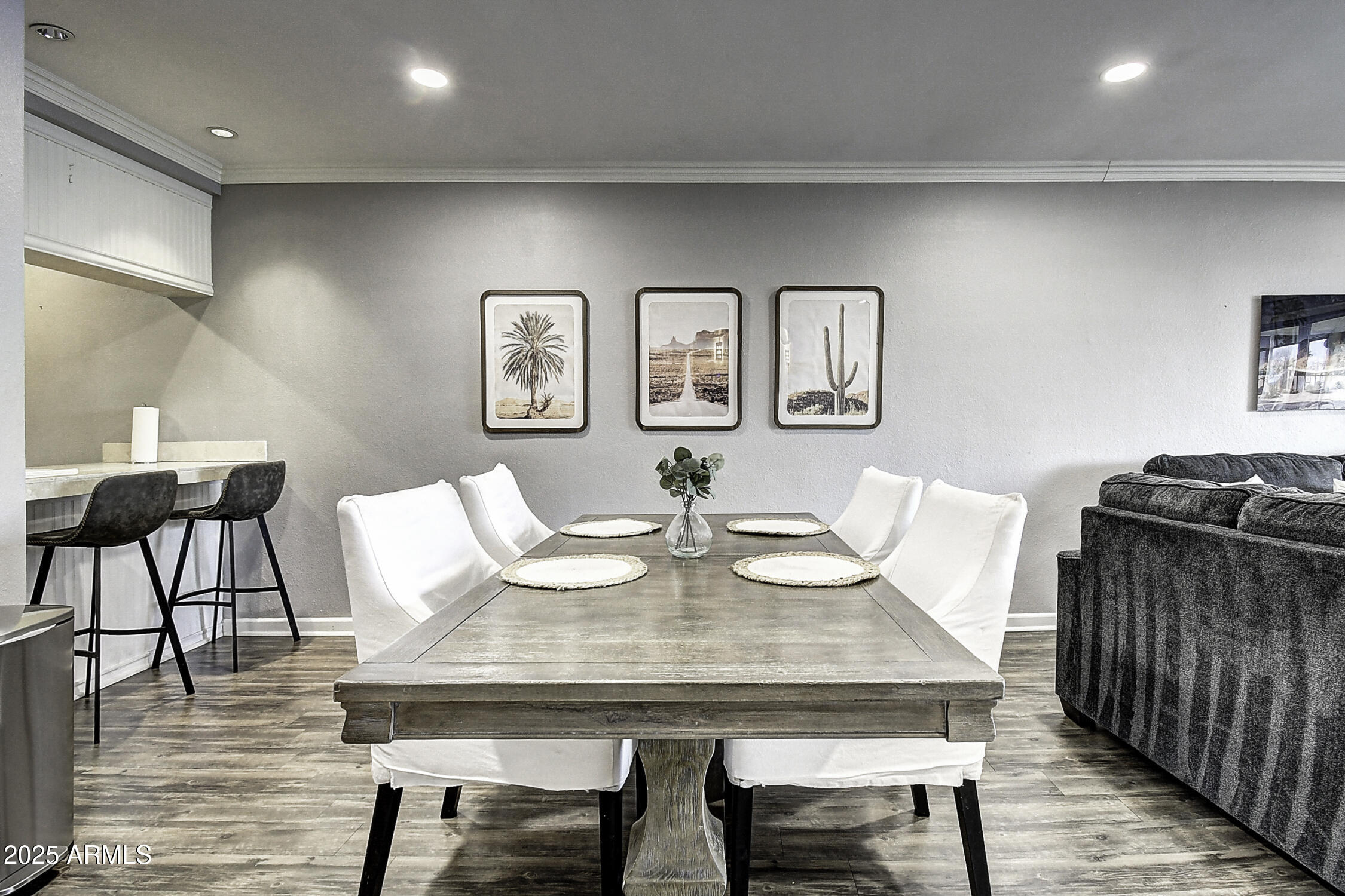 7625 East Camelback Road, Unit B203 Scottsdale, AZ 85251 - Photo 15 of 29 a view of a dining room with furniture and wooden floor