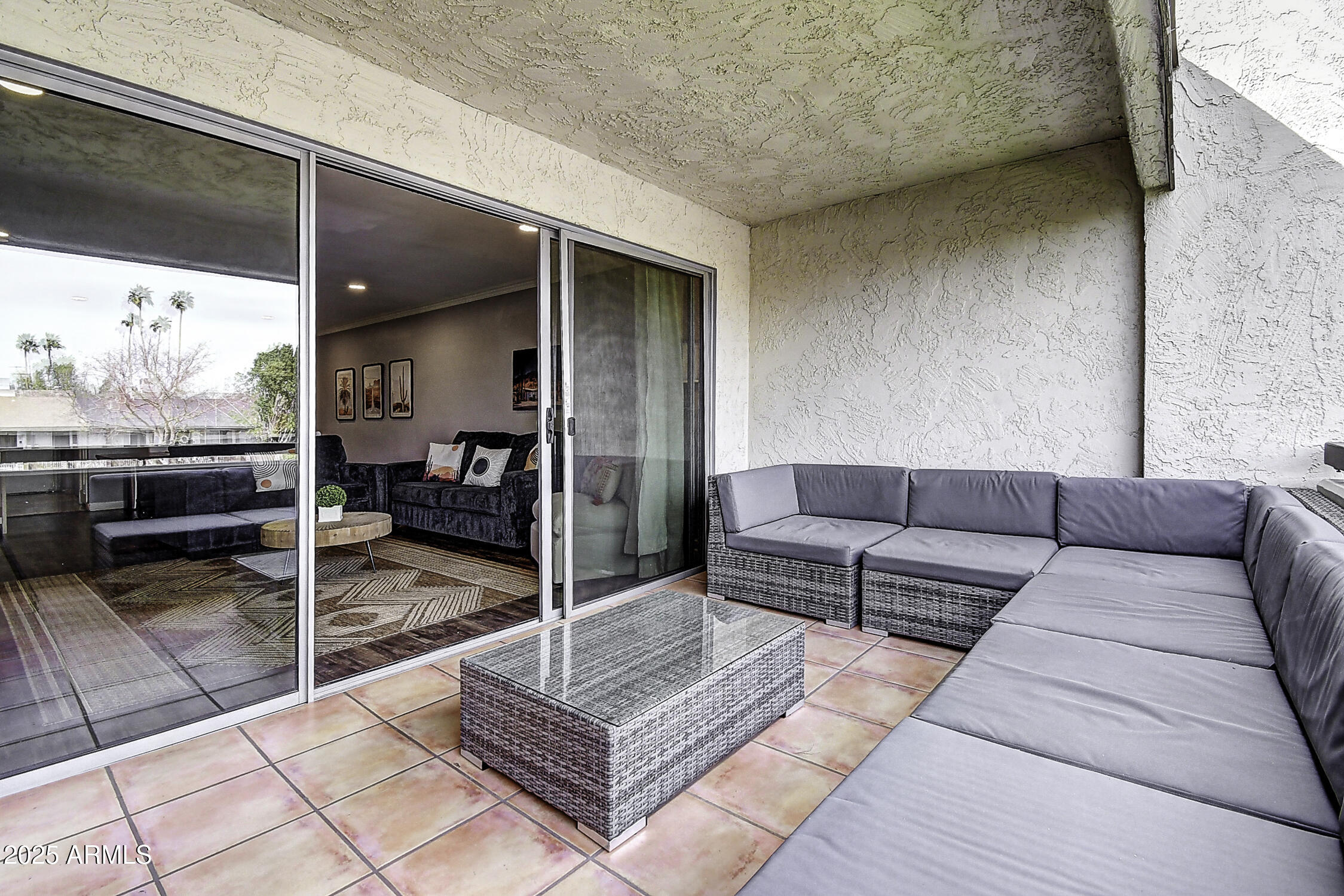 7625 East Camelback Road, Unit B203 Scottsdale, AZ 85251 - Photo 16 of 29 a living room with furniture and a floor to ceiling window