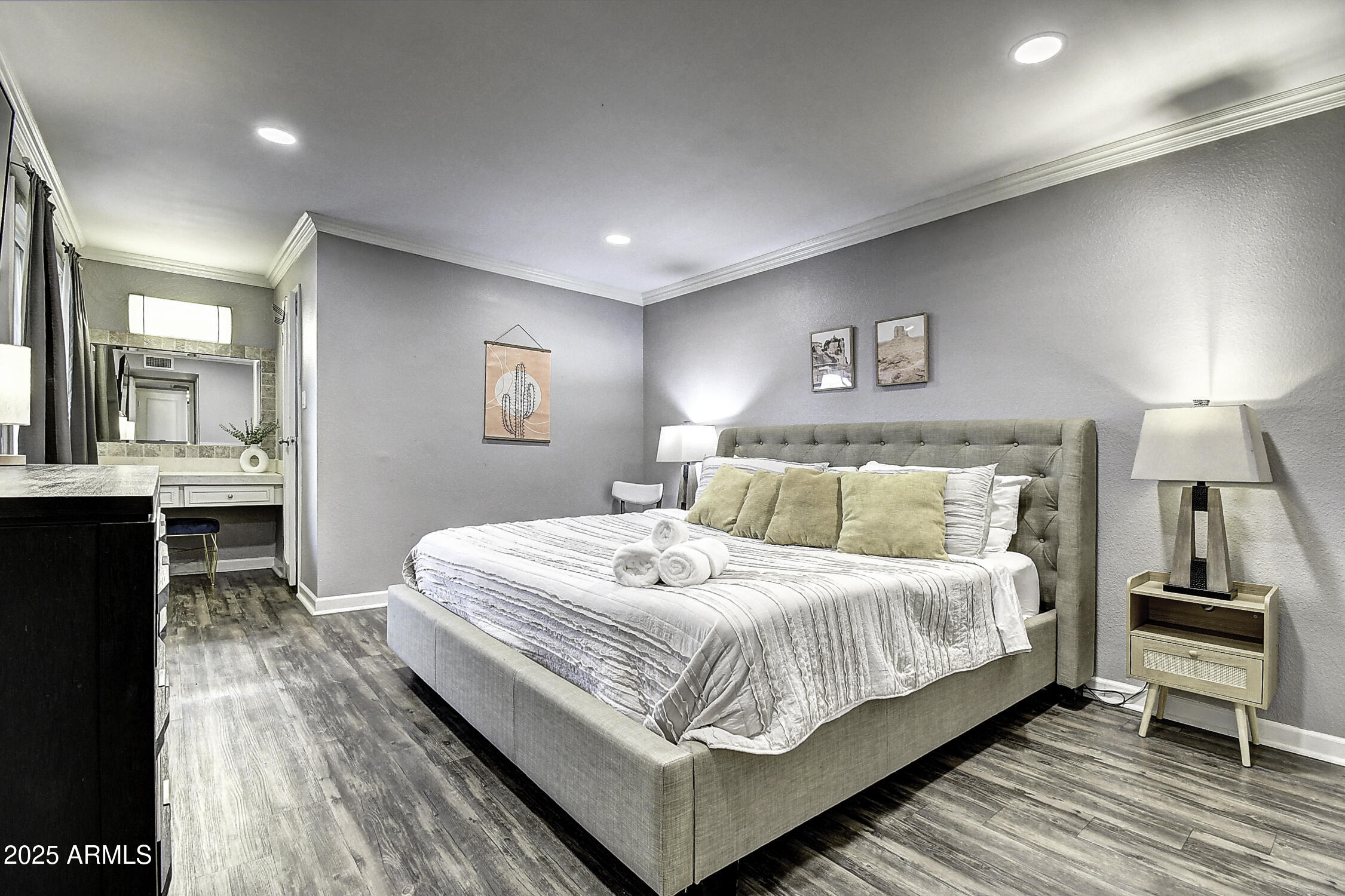 7625 East Camelback Road, Unit B203 Scottsdale, AZ 85251 - Photo 18 of 29 a bedroom with a bed and a view of kitchen