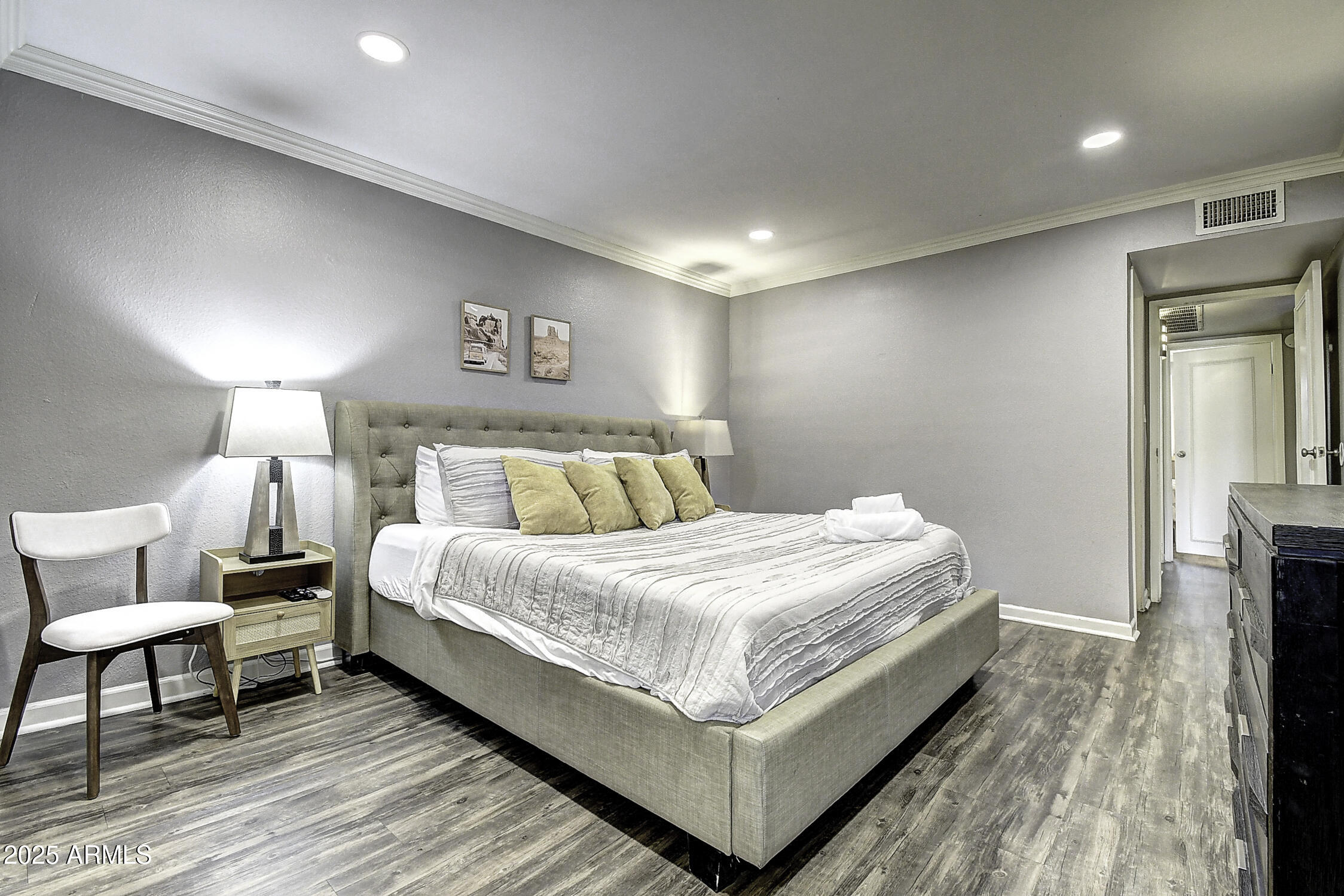 7625 East Camelback Road, Unit B203 Scottsdale, AZ 85251 - Photo 19 of 29 a large bed sitting in a bedroom and a table