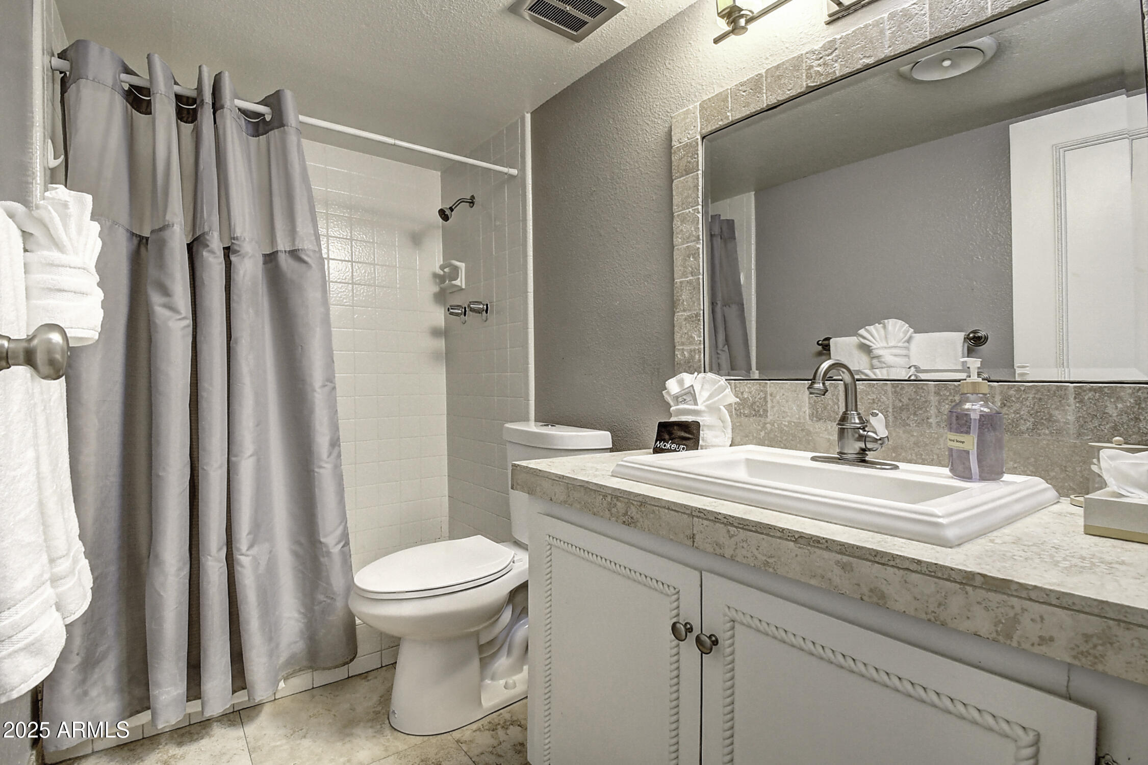 7625 East Camelback Road, Unit B203 Scottsdale, AZ 85251 - Photo 22 of 29 a bathroom with a sink a toilet and shower