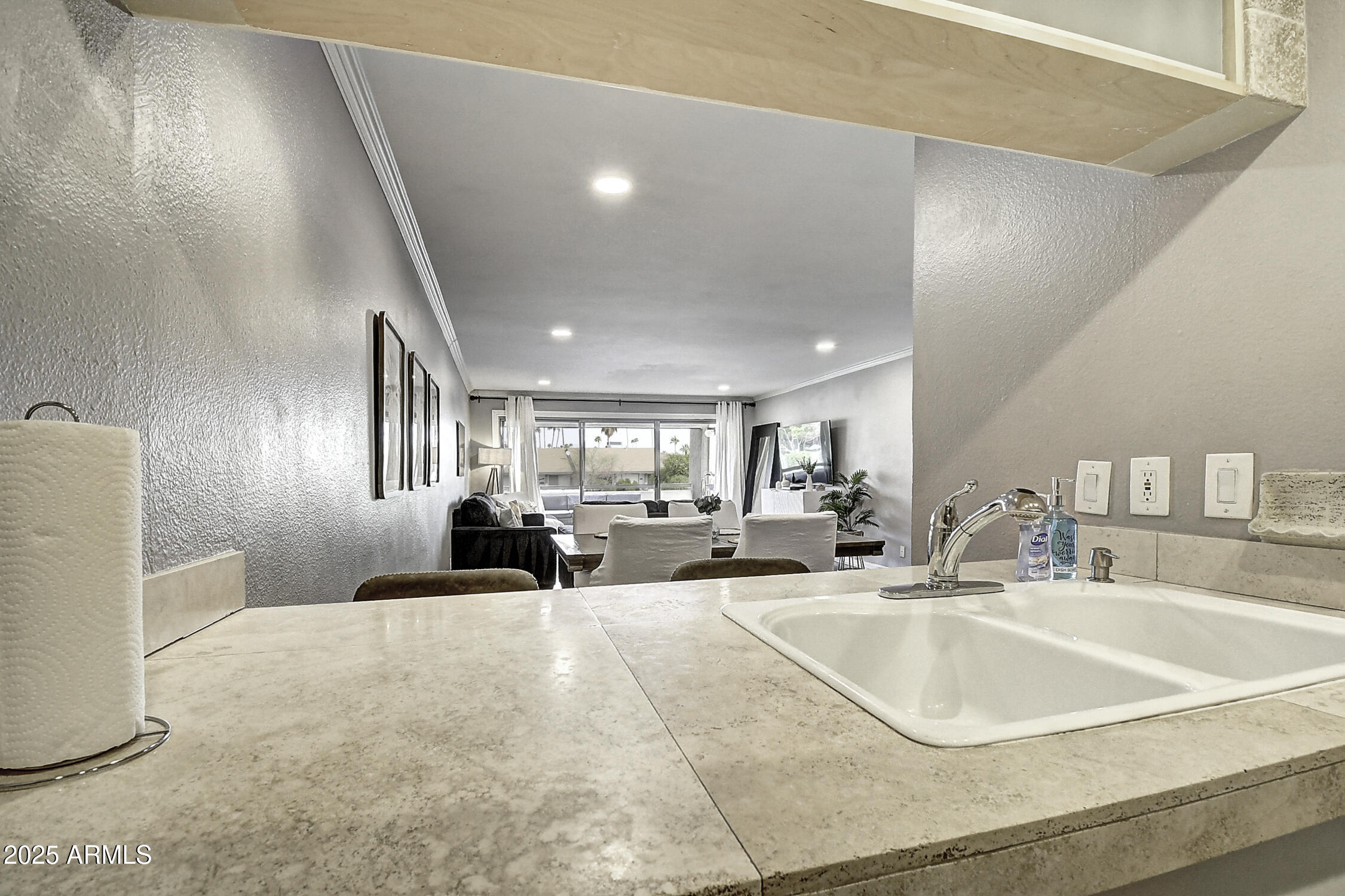 7625 East Camelback Road, Unit B203 Scottsdale, AZ 85251 - Photo 10 of 29 a large white kitchen with a large window