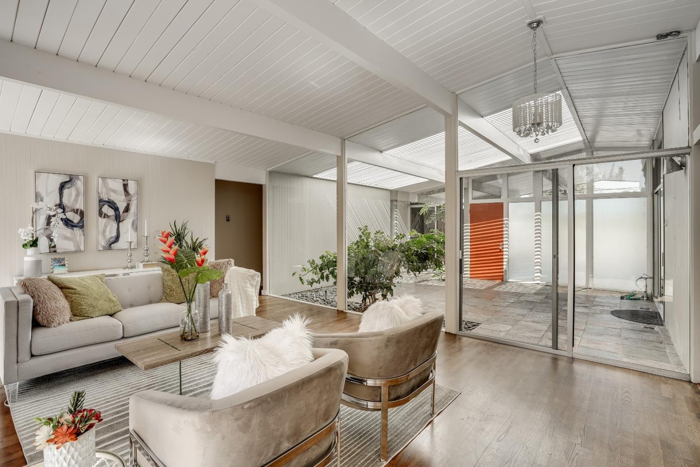 1401 South Wolfe Road Sunnyvale, CA 94087 - Photo 18 of 67 a living room with furniture and a chandelier