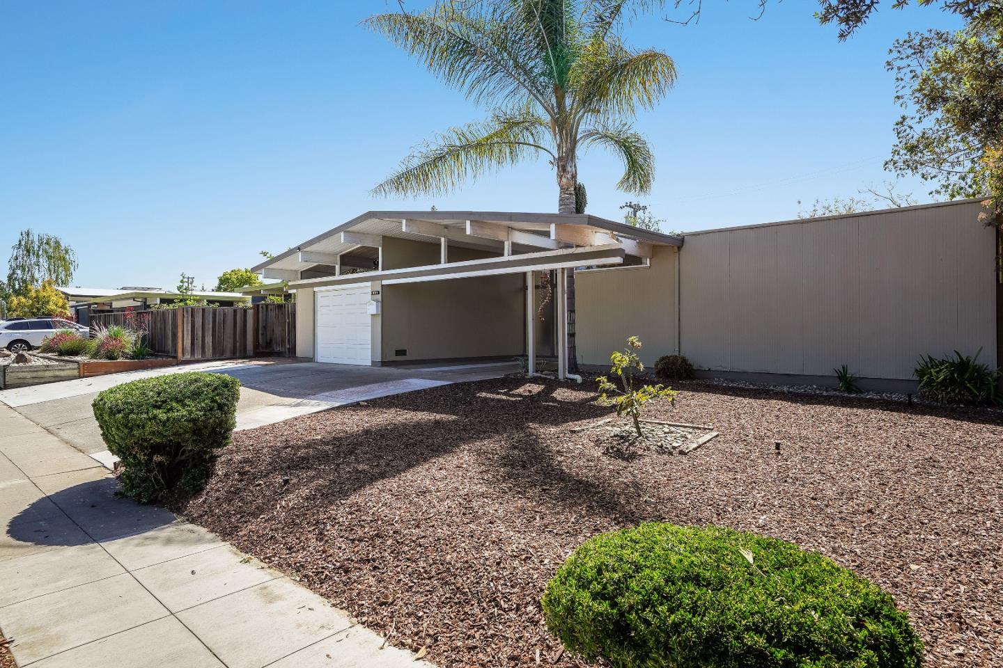 1401 South Wolfe Road Sunnyvale, CA 94087 - Photo 3 of 67 a front view of a house with garden