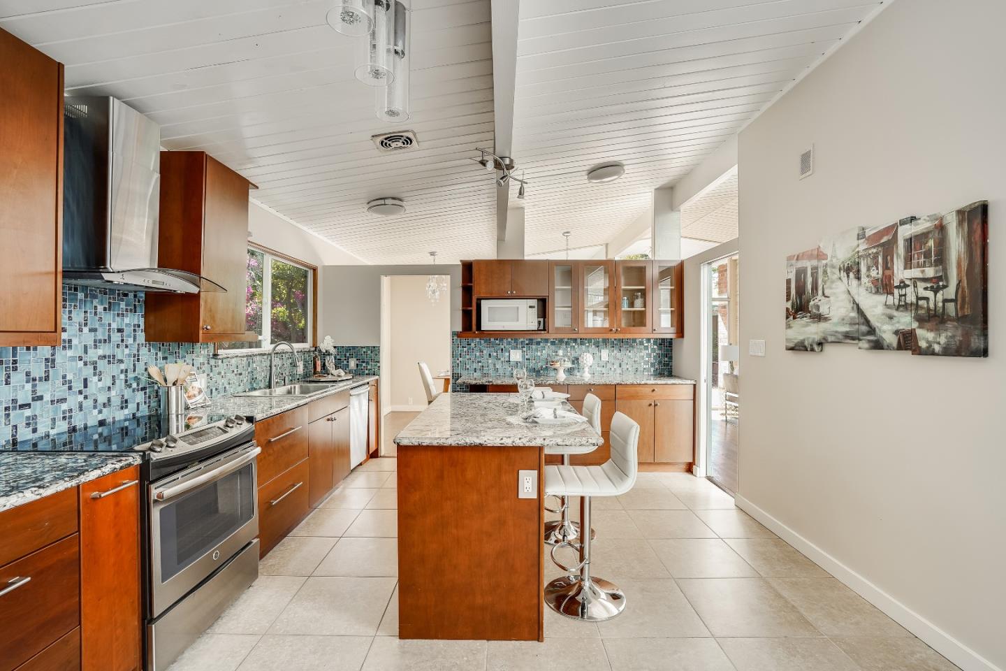 1401 South Wolfe Road Sunnyvale, CA 94087 - Photo 31 of 67 a large kitchen with stainless steel appliances kitchen island granite countertop a sink and cabinets