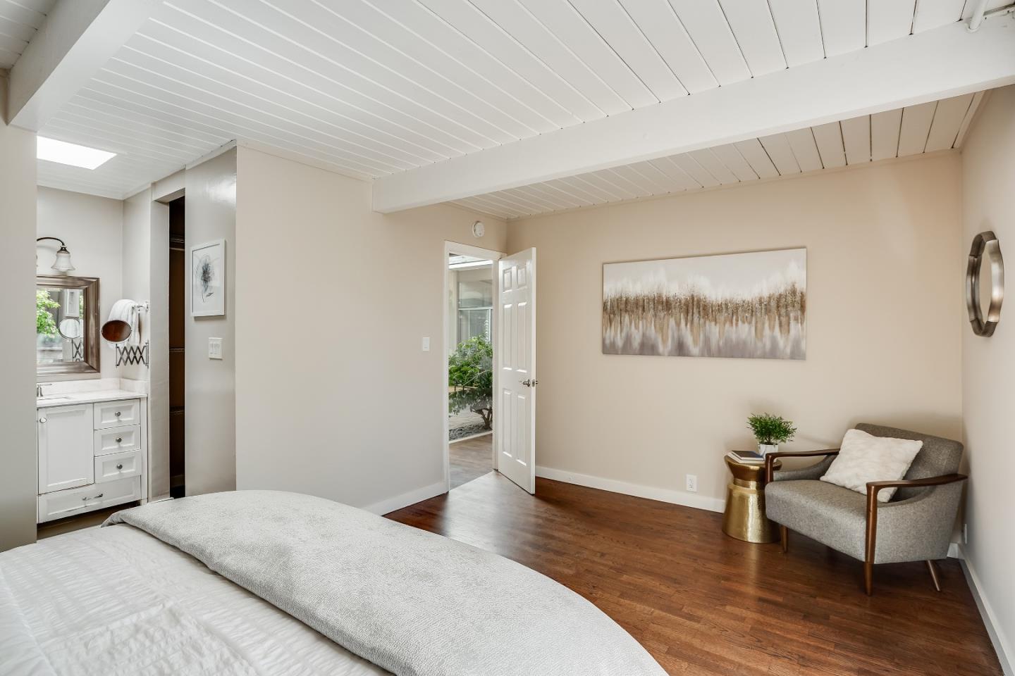 1401 South Wolfe Road Sunnyvale, CA 94087 - Photo 39 of 67 a bedroom with furniture and a wooden floor