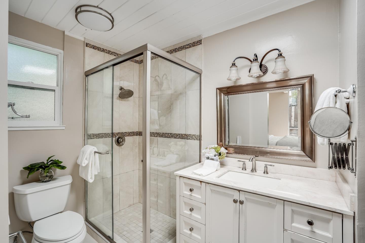 1401 South Wolfe Road Sunnyvale, CA 94087 - Photo 40 of 67 a bathroom with a granite countertop sink toilet and shower