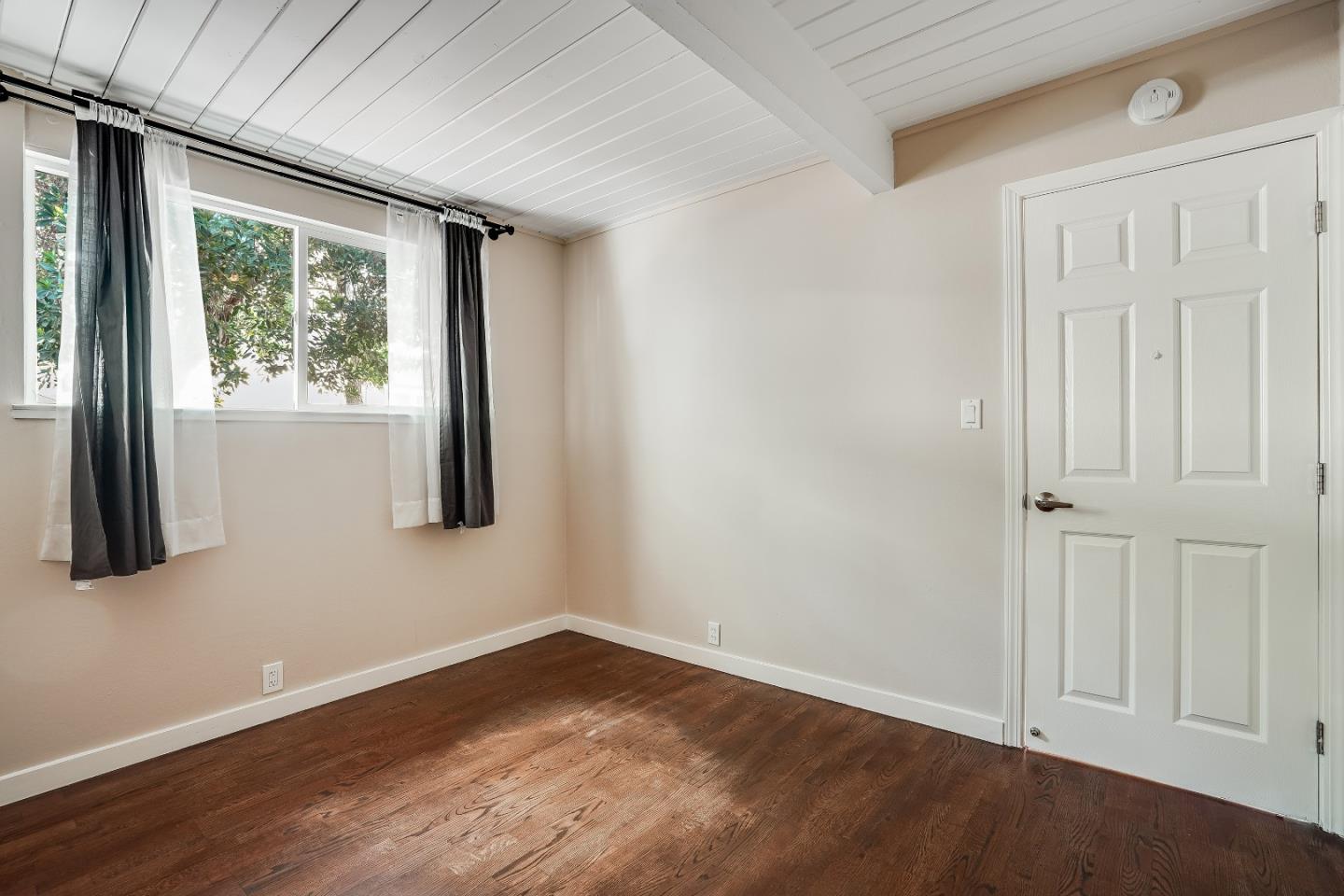 1401 South Wolfe Road Sunnyvale, CA 94087 - Photo 46 of 67 an empty room with wooden floor and windows