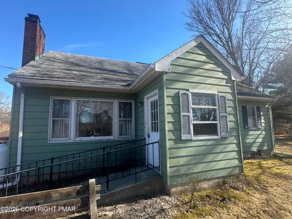 a view of a house with a window and wooden floor