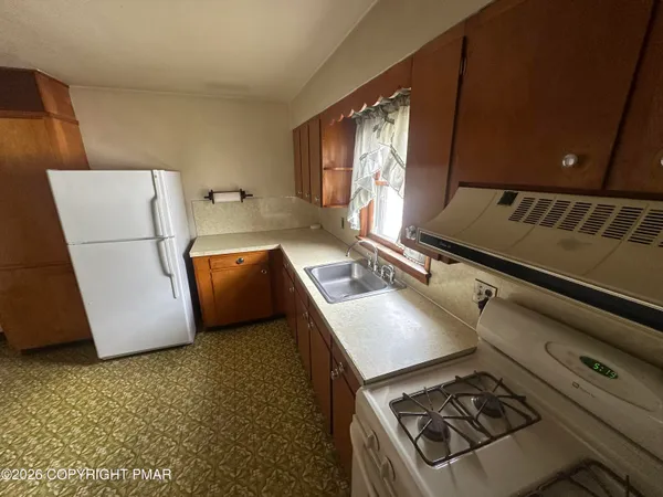 a kitchen with a stove and a microwave