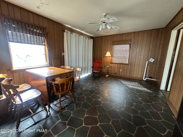 a view of a room with furniture and window