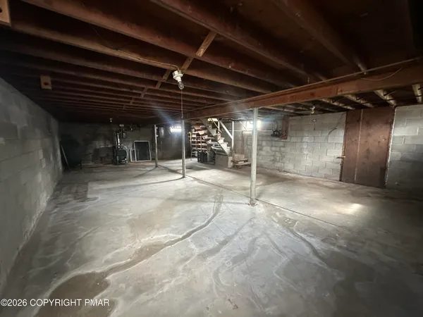 a view of empty room with wooden ceiling