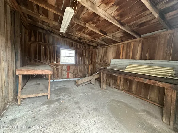 a view of an empty room with a fireplace