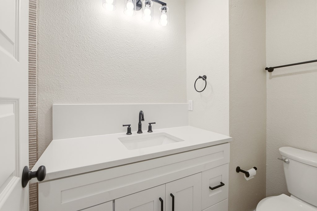 150 Oak Ridge Dr Center Point Center Point, TX 78010 - Photo 7 of 13 a bathroom with a sink and a toilet