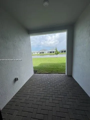 a view of an empty room with a garden