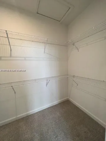 a view of a room with racks on the wall