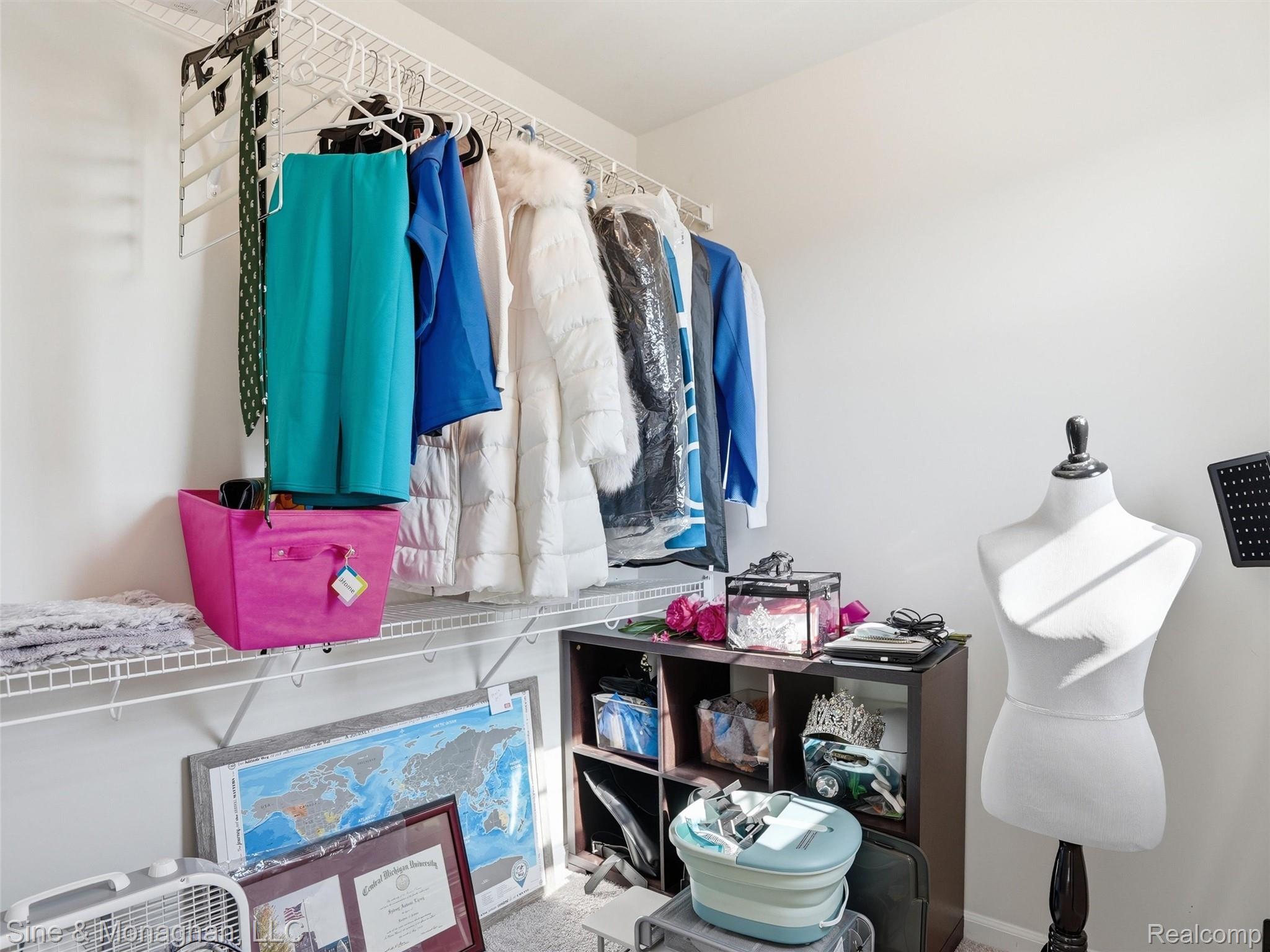 24827 Ivy Road Novi, MI 48375 - Photo 27 of 38 Walk-in closet featuring white wire shelving, a hanging rod system, and neutral wall paint