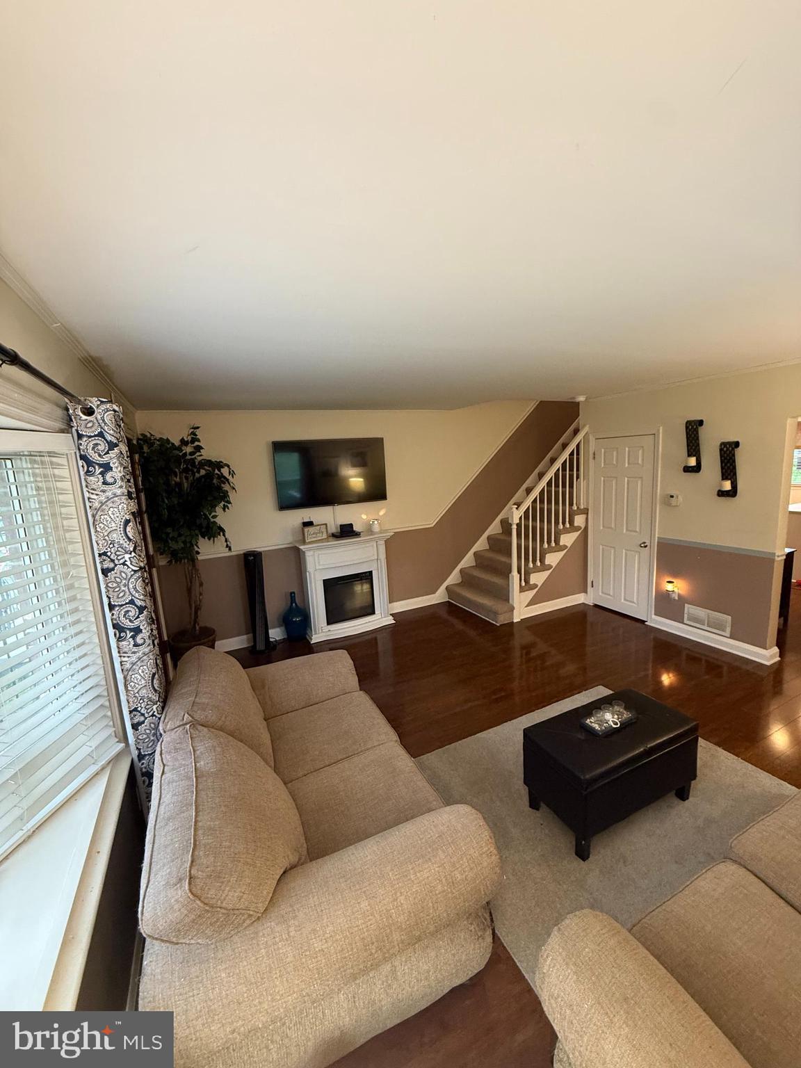 2235 Hawthorne Road Baltimore, MD 21220 - Photo 5 of 35 a living room with furniture and a flat screen tv