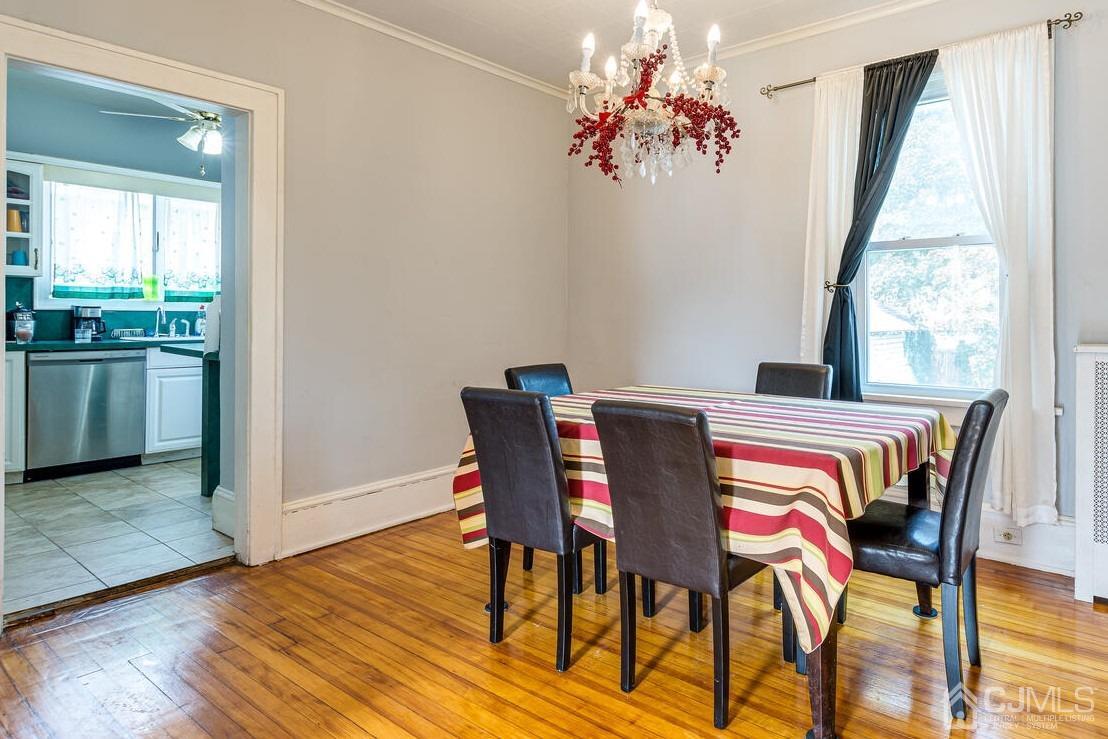 44 Freeman Street Woodbridge, NJ 07095 - Photo 4 of 8 a view of a dining room with furniture window and wooden floor