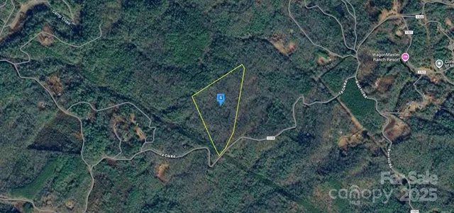 a backyard of a house with lots of trees