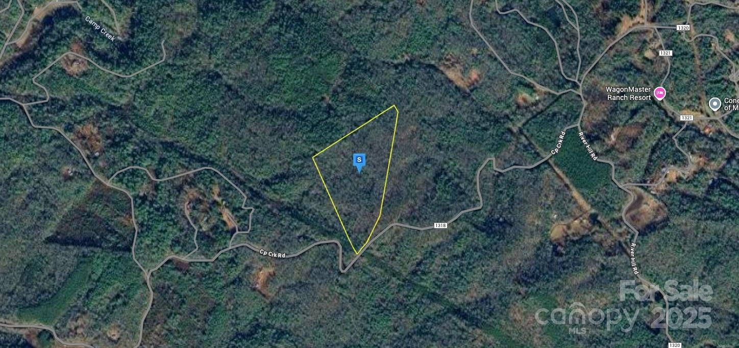 a backyard of a house with lots of trees