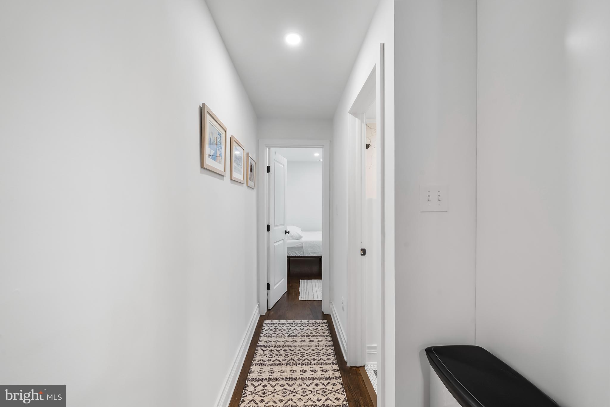 609 North 17th Street, Unit 1 Philadelphia, PA 19130 - Photo 11 of 32 a view of a hallway with wooden floor and a bathroom